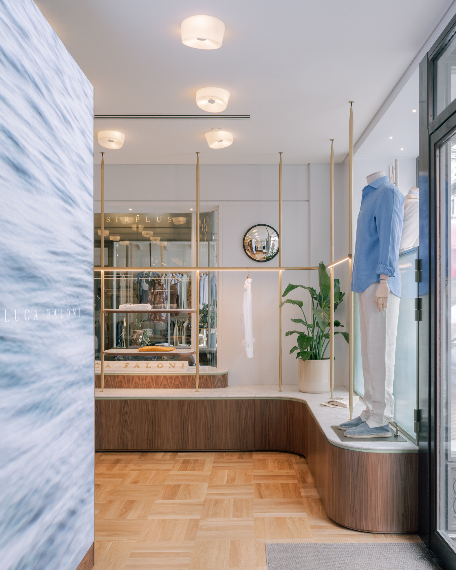 Display system designed for the shop window of a quiet luxury menswear shop.