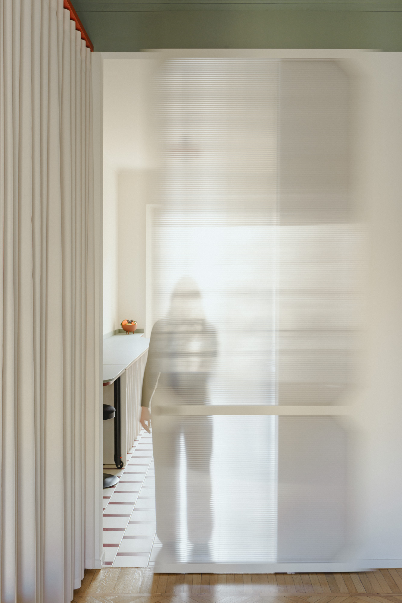 Semi-transparent sliding door made of polycarbonate.